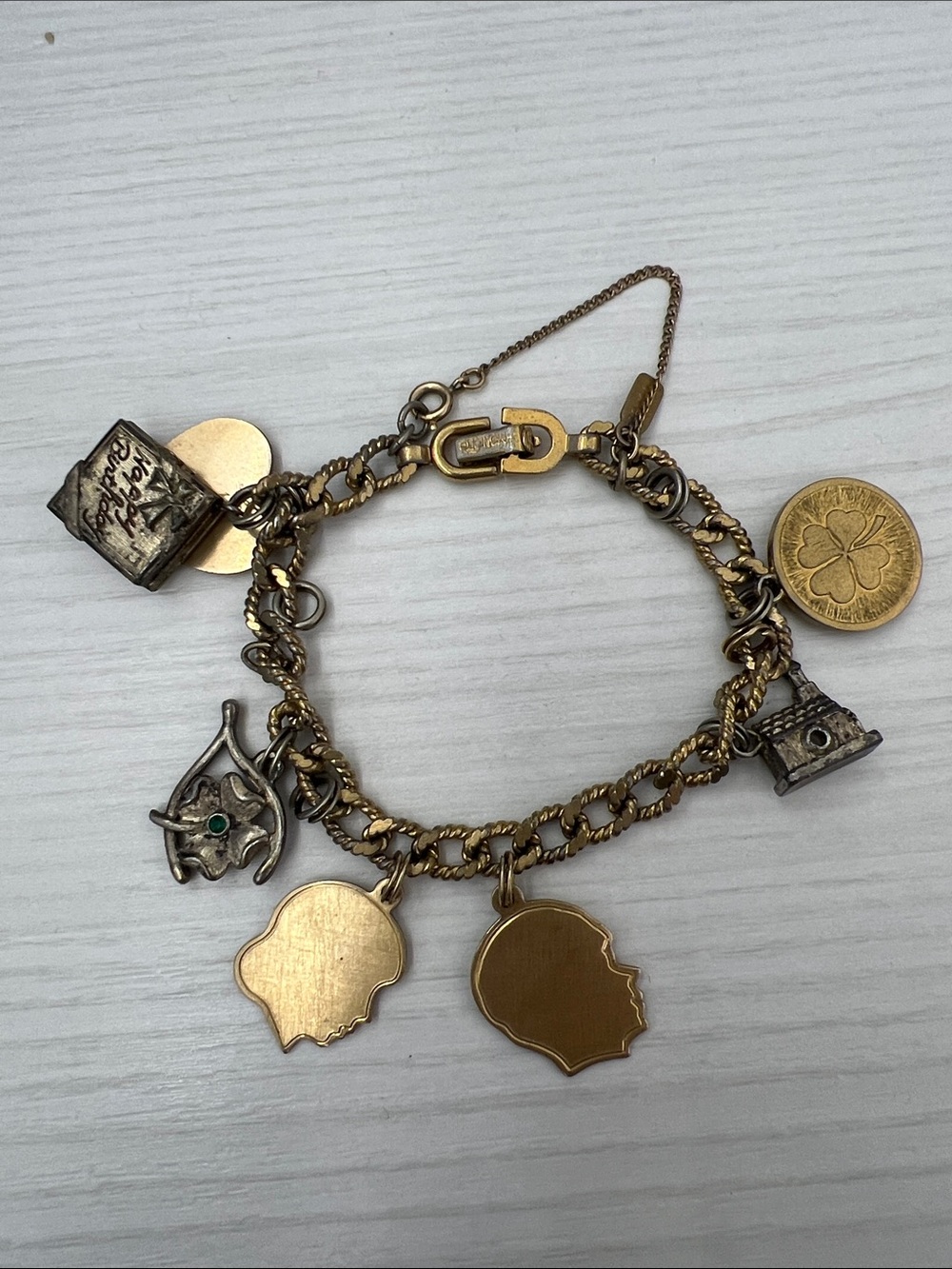 Monet Gold-Tone Charm Bracelet with Clover, Book & Shield Pendants